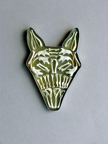 Kiff Slemmons, wolf head made of metal and tiny mouse bones.