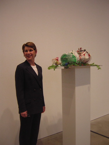 Mari Shaw posing with Empire/Vampire I by Isa Genzken at the Philadelphia Art Museum's first Notations show, Energy Yes! in 2006. The piece was on loan from Shaw and her husband Peter.