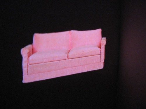 The sofa at the end of the hallway is a video projection that's part of a larger installation by John Lightfoot Greiner