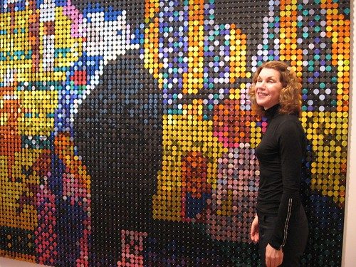 Here's Mari Shaw in front of Stuart Netsky's Grande Jatte, all made of sequins. The Netsky is a part of her extensive collection