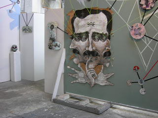 Installation of These Ghosts That Haunt Us with Kline’s collage, The Road to El Dorado, a portrait of Edgar Allen Poe.