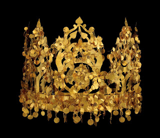 Crown, Tillya Tepe, gold (1st century B.C.), National Museum, Kabul, photo © Thierry Ollivier/Musée Guimet. The pendant discs that cover this crown must have created a shimmering vision when worn. It was found in a woman’s tomb and can easily be dis-assembled for transport - early travel clothing. Nomadic peoples often carried their wealth on the body.
