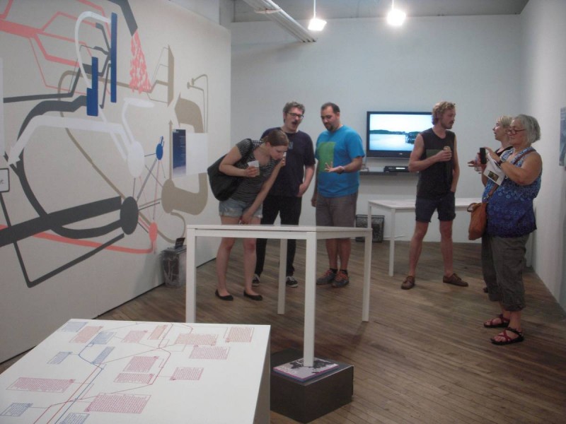 crowd looking at sculpture and wall painting Vox Populi Gallery Philadelphia