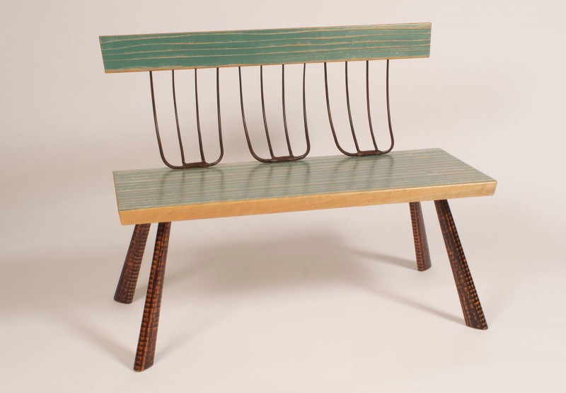 Brad Smith, Pitchfork Bench , 42" long ,32" high ,23"deep. Cherry seat and back (textured and painted) charred Ash legs , steel pitchforks. Image by Michael O'Neil