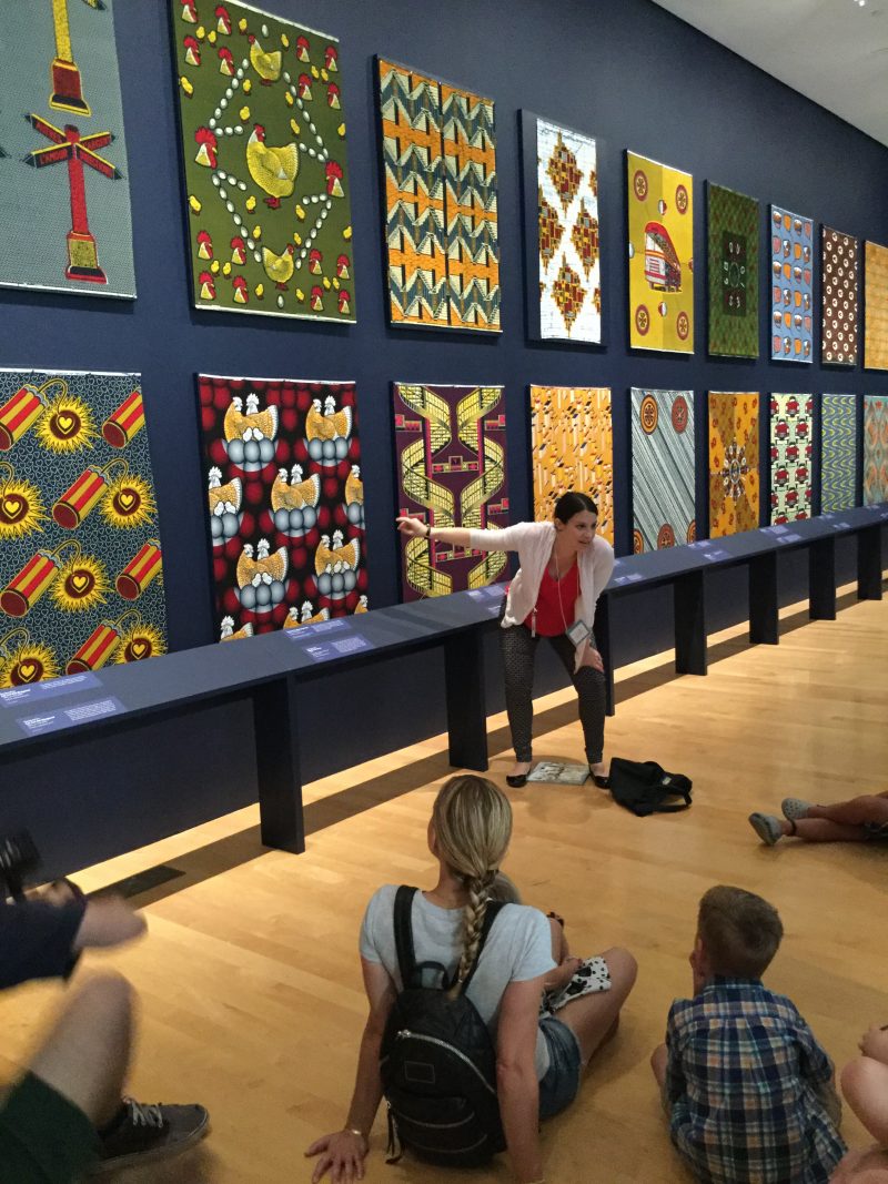 Art Splash, families and teacher looking at the Vlisco patterned cloth in the Creative Africa exhibition