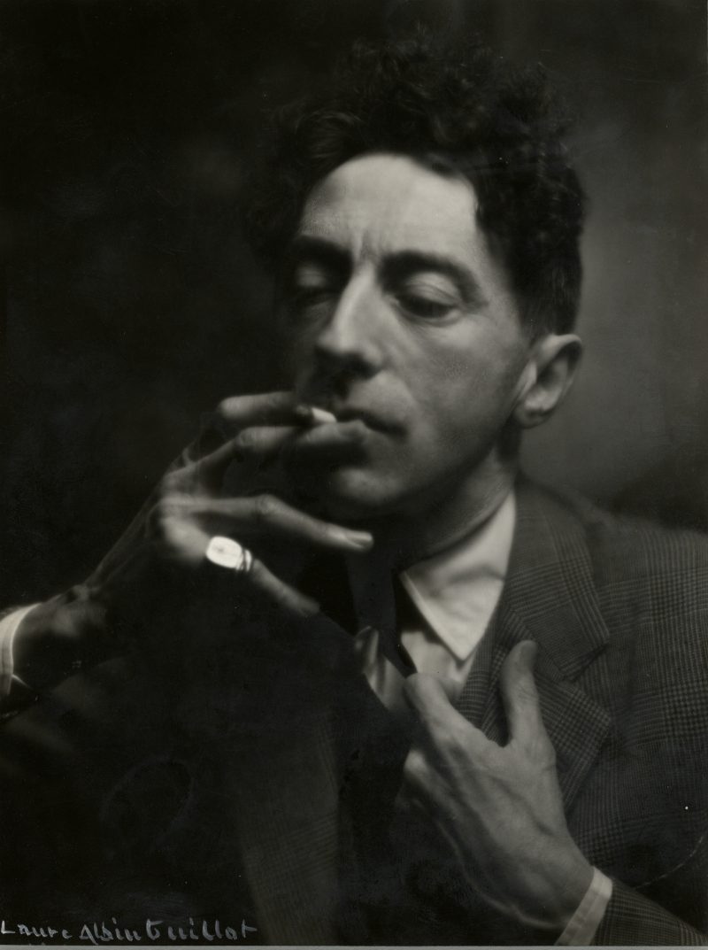 Laure Albin-Guillot (French, d. 1962). Jean Cocteau, 1934. Ferrotyped gelatin silver print, 8 7/8 x 6 5/8 in. Collection of Michael Mattis and Judy Hochberg.