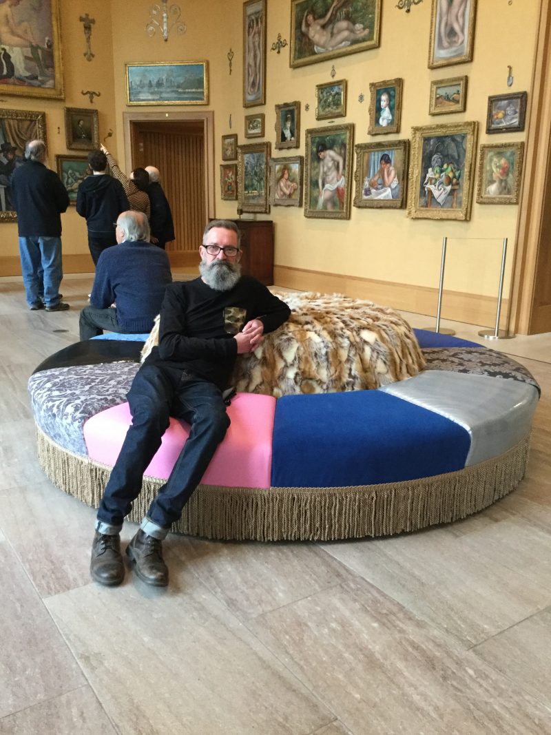 Virgil Marti sitting on a comfortable "pouf"