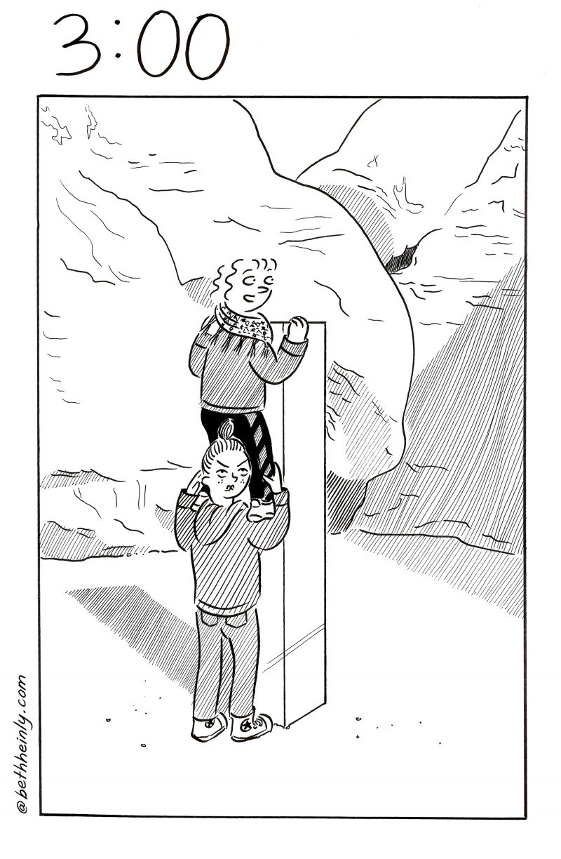 One panel comic shows two women in a desert surrounded by huge rock walls.  There’s a Monolith in the clearing in front of the rocks.  One girl, looking back at the reader and scowling, holds the second girl on her shoulders.  The girl on top of her shoulders holds the top of the monolith and looks back at the reader and smiles.