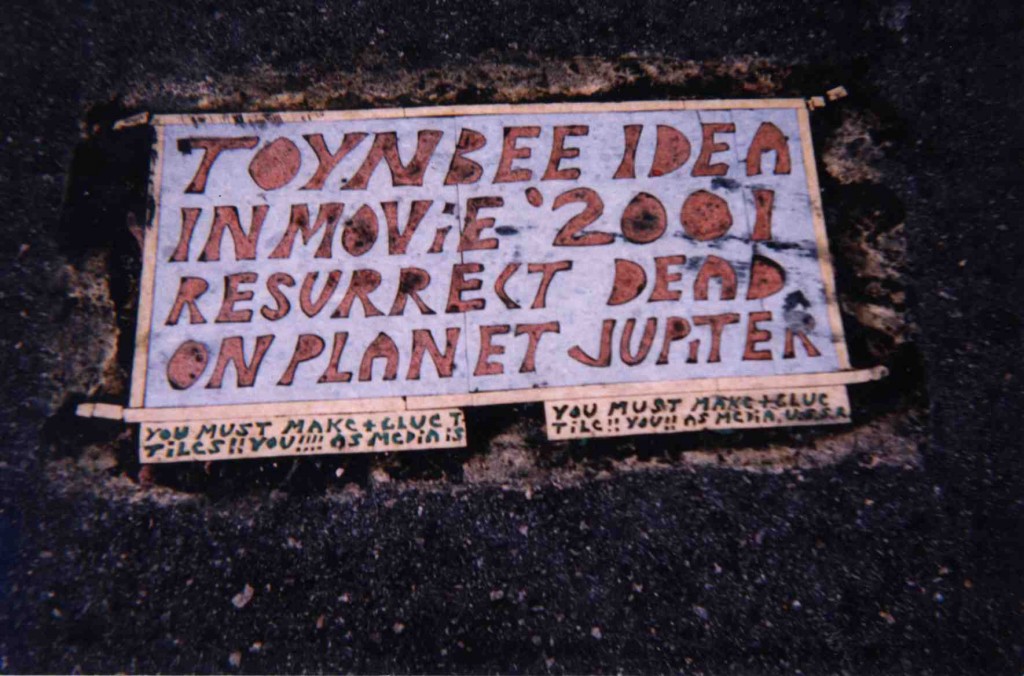photo by Justin Duerr of Toynbee Tiles inlaid in streets of Philadelphia, New York and elsewhere
