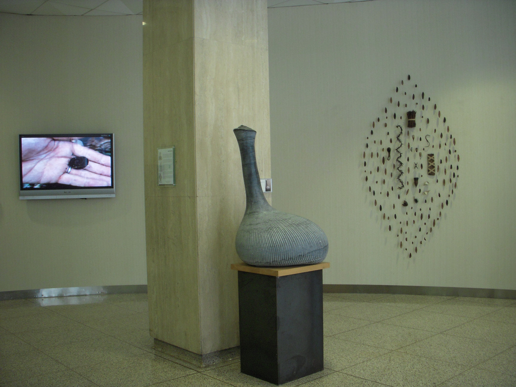 Ron Klein, work installed in the lobby of the Time Equities Building in lower Manhattan. That's a video on the left of Klein showing him collecting the natural material he uses.