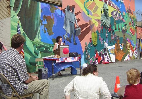 That's Deborah Zuchman behind the podium speaking, in front of a mural created in 2005 by Eliseo Silva and the students at Spruance Elementary School in Northeast Philadelphia.