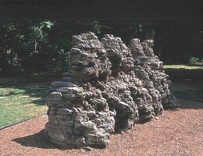 Ursula von Rydingsvard, ence pence, 1997, cedar and graphite, 89 ½" x 186 1/8" x 72", DeCordova Museum, Lincoln, MA. Lent by the Artist; Courtesy Galerie Lelong, New York, NY and Barbara Krakow Gallery, Boston, MA