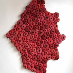 "Pelt" by Emily Barletta. This is included in her current solo exhibition, "My Biology" and it is crocheted yarn - 51 " x 38" x 2"