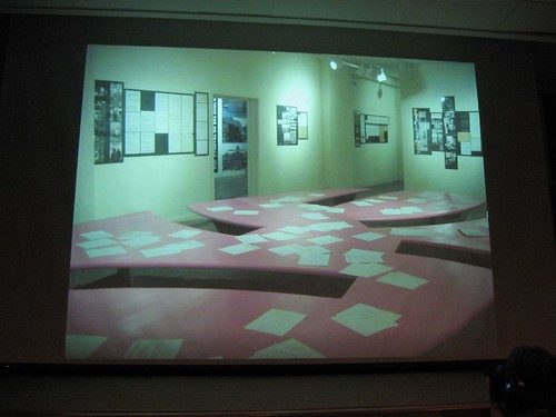 A view of the Acconci exhibit at Slought, featuring a pink table designed by Acconci Studio and built by the guys out at Art Making Machine Studios.