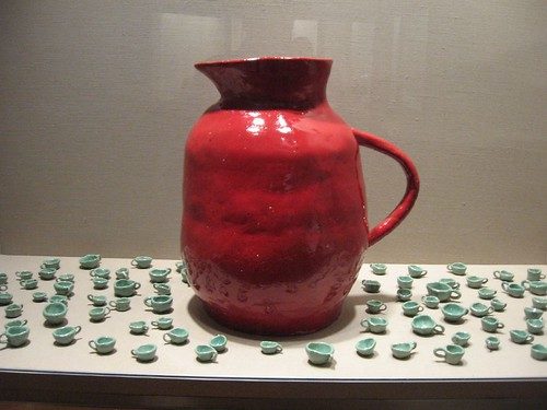 David Shrigley, Jugs and Cups, 2008, detail, installation in vitrine of glazed ceramic objects--2 ceramic jugs and 159 small cups, courtesy of the artist, in Life on Mars