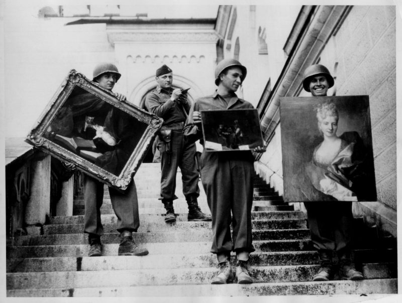 At Schloss Neuschwanstein in southern Bavaria, Captain James Rorimer, who later would become the director of the Metropolitan Museum of Art, supervises the safeguarding of art stolen from French Jews and stored during the war at the castle (April-May, 1945). Photo Source: National Archives and Records Administration
