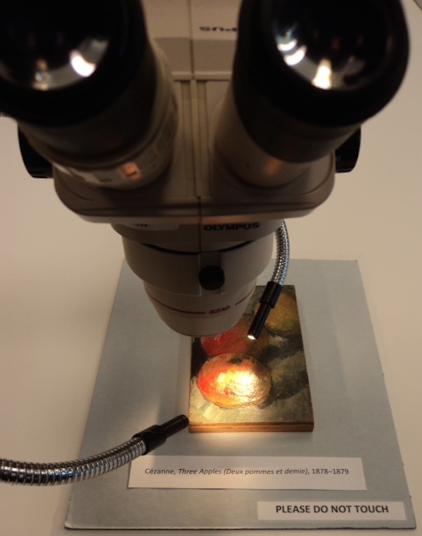 conservation microscope trained on Cézanne's Three Apples, 1878-1879