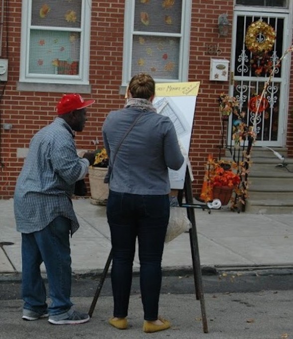 People in front of map