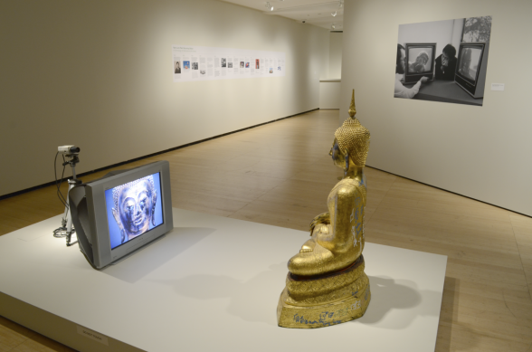 Sculpture in front of a television and camera