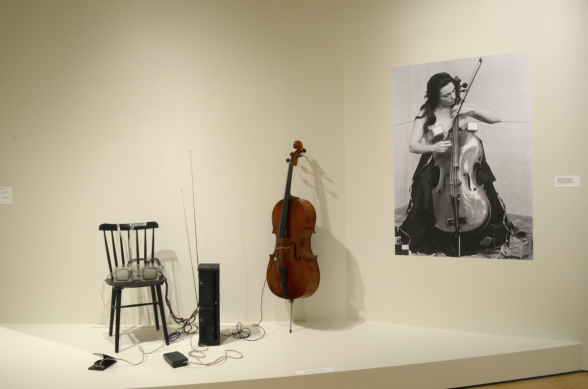 Photograph of performance next to items used in the performance