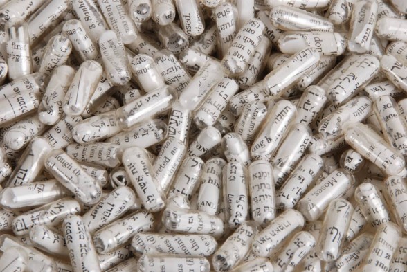 Pills filled with scrolls of text