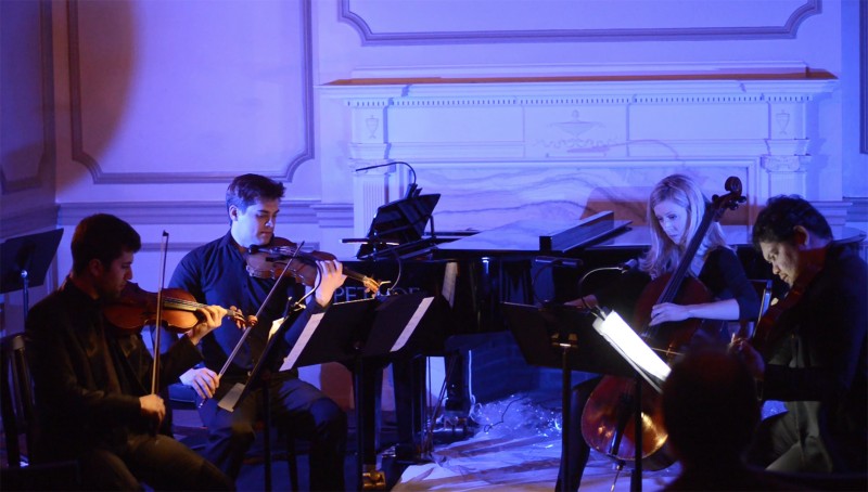 Fine Art Music Company, Ivy Hall, Musical Ode to Earth concert, String Quartet playing David Ludwig’s “Pale Blue Dot.” Musicians left to right are Azer Damirov, violin; James Wilson Lawrence, violin; Julia Morelli, cello; Lorenzo Raval, viola. Image courtesy of Celeste Hardester