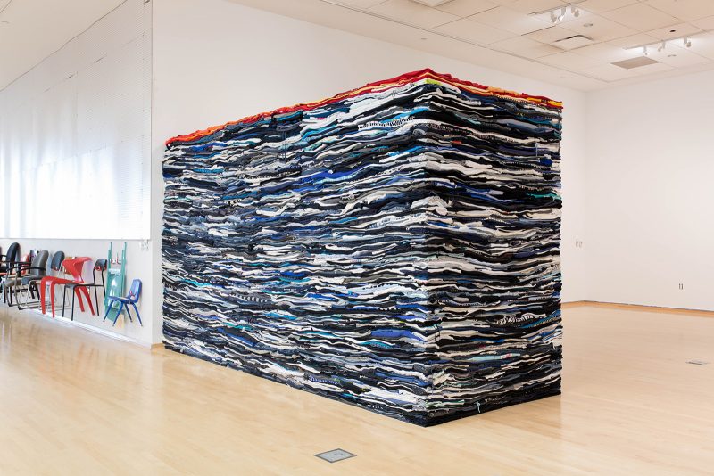 Derek Melander's folded and stacked second-hand clothing. Image courtesy of Temple Contemporary.
