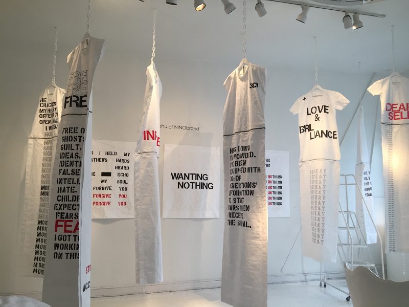 Tyvek dresses and prints from the series "I Forgive You" by Bela Shehu. Photo by Shaina Nyman.