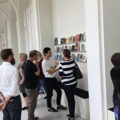 Chorus member, Park Gun Woo and our group looking at and talking about Maria Eichhorn’s Library and Reading Room, Rose Valland Institute, 2017, Neue Galerie, Documenta 14