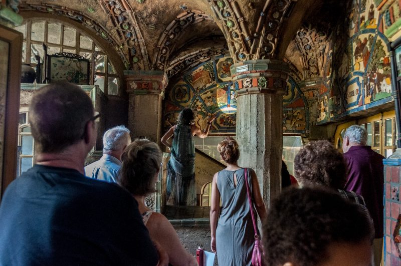 Fonthill, with tour guide speaking about tiles on the walls. Photo by Chuck Patch, with permission