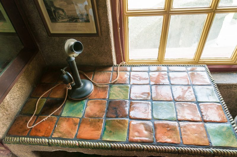 Fonthill, detail, showing a built-in desk and period telephone in a guest bedroom. Photo by Chuck Patch, with permission