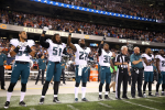 Philadelphia Eagles players Steven Means (51), Malcolm Jenkins (27) and Ron Brooks (33) raise their fists during the national anthem on September 2016. CREDIT: Chris Sweda for the Chicago Tribune.