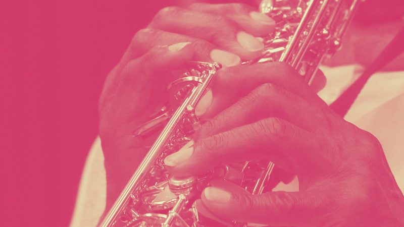 Closeup of fingers and instrument of person playing jazz 