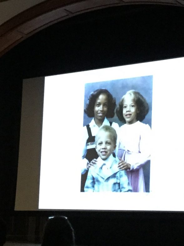 Amy Sherald's first slide shows herself and her two siblings. A family photo.
