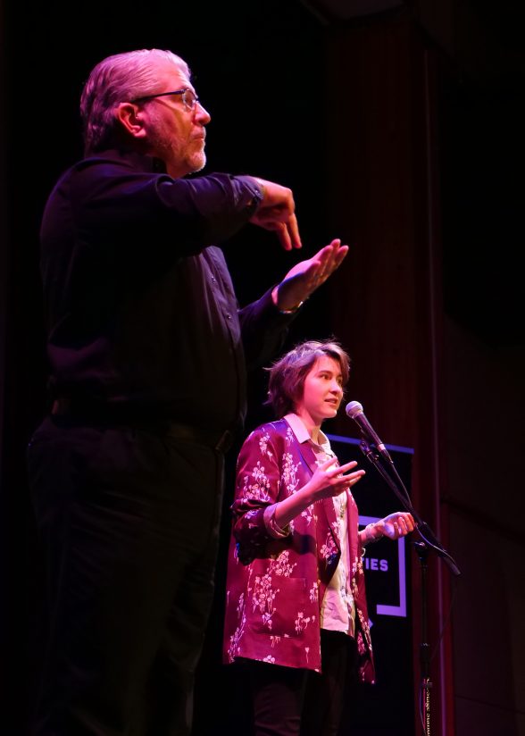 Charlie Bruce in "Rebirths, Returns, and Comebacks," Image of presenter Charlie Bruce and interpreter Cren Quigley courtesy of Sarah Milinski / Wolf Humanities Center.