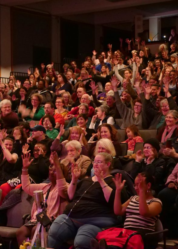 "Rebirths, Returns, and Comebacks," Image of the audience courtesy of Sarah Milinski / Wolf Humanities Center. Raised hands connote clapping in ASL.