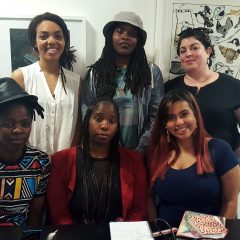 Imani Roach speaks with the Women's Mobile Museum, May, 2018. Front row (L to R): Artist Zanele Muholi, apprentices Shasta Bady and “Muffy” Ashley Torres; Back row (L to R): Imani Roach, apprentices Latasha “Tash” Billington and Carrie-Anne Shimborski