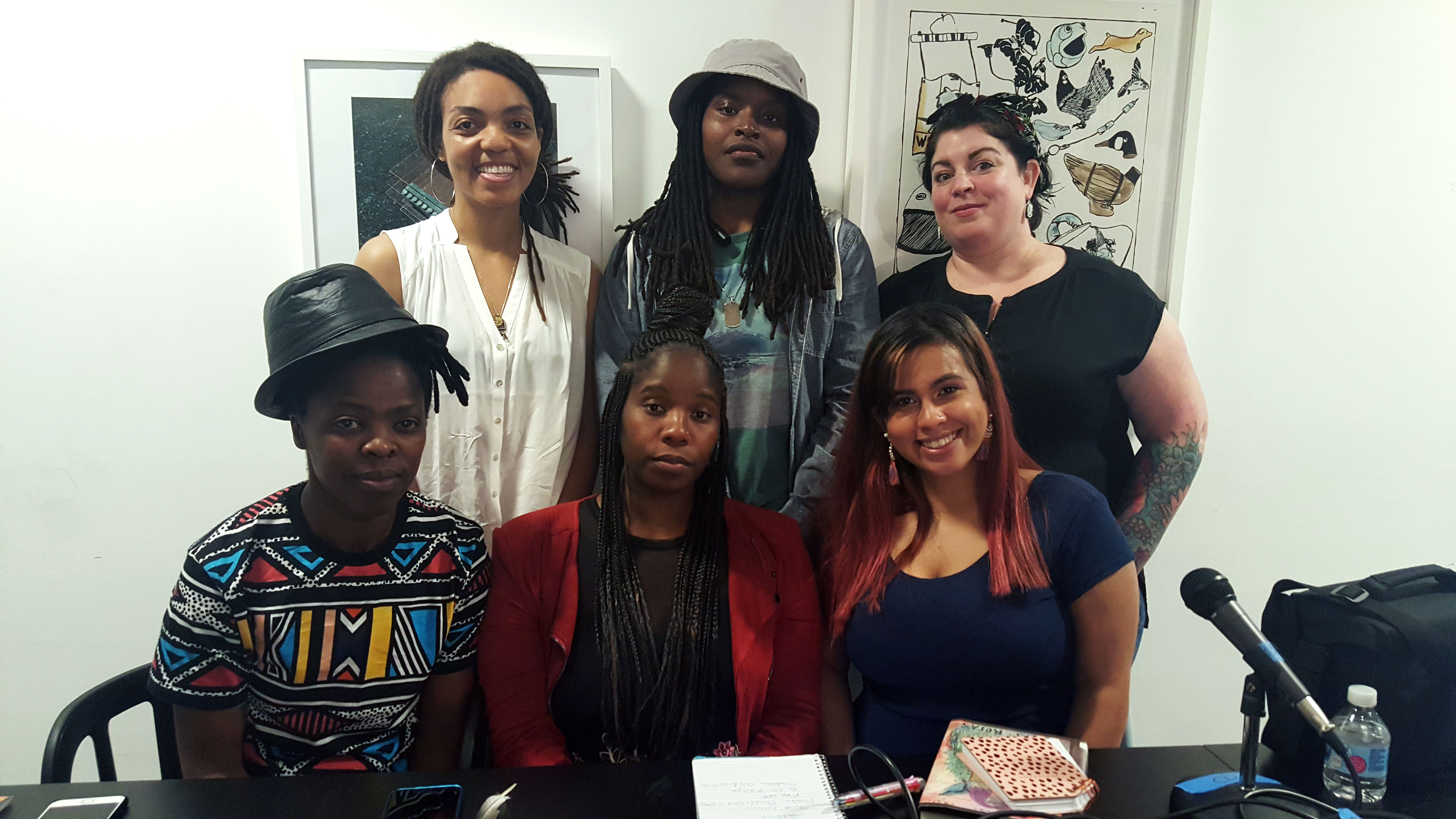 Imani Roach speaks with the Women's Mobile Museum, May, 2018. Front row (L to R): Artist Zanele Muholi, apprentices Shasta Bady and “Muffy” Ashley Torres; Back row (L to R): Imani Roach, apprentices Latasha “Tash” Billington and Carrie-Anne Shimborski