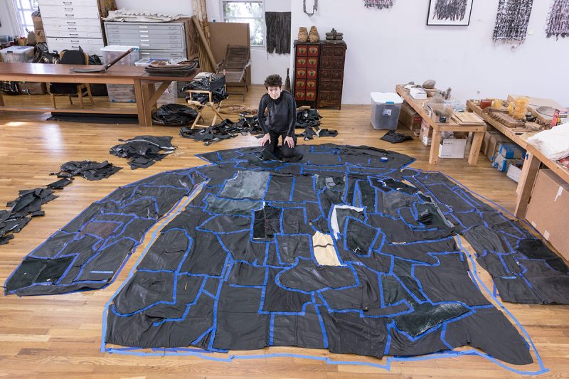 Ursula von Rydingsvard at work on "PODERWAĆ" in her Brooklyn studio. Photo credit Carlos Avendaño.