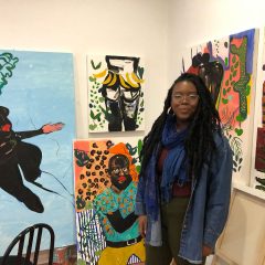 Patricia Thomas with her paintings in her 40th Street Artist in Residence studio. Photo courtesy of Morgan Nitz