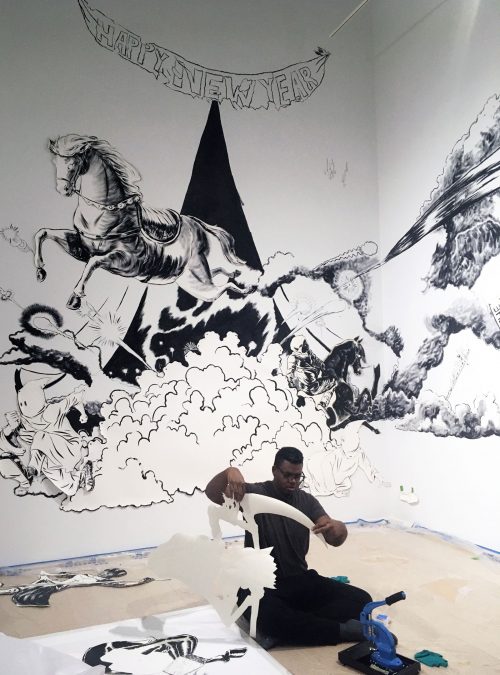 Mark Thomas Gibson at work installing "The Dangerous One" at Rosenwald-Wolf Gallery. Photo courtesy of Kathryn Gegenheimer.