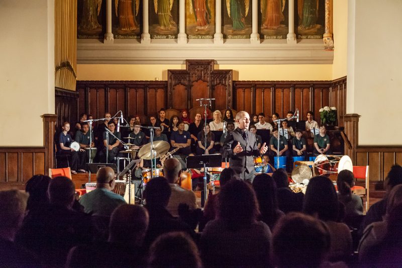 Hafez Kotain performing at the Trinity Center for Urban Life. Photo courtesy Chip Colson.