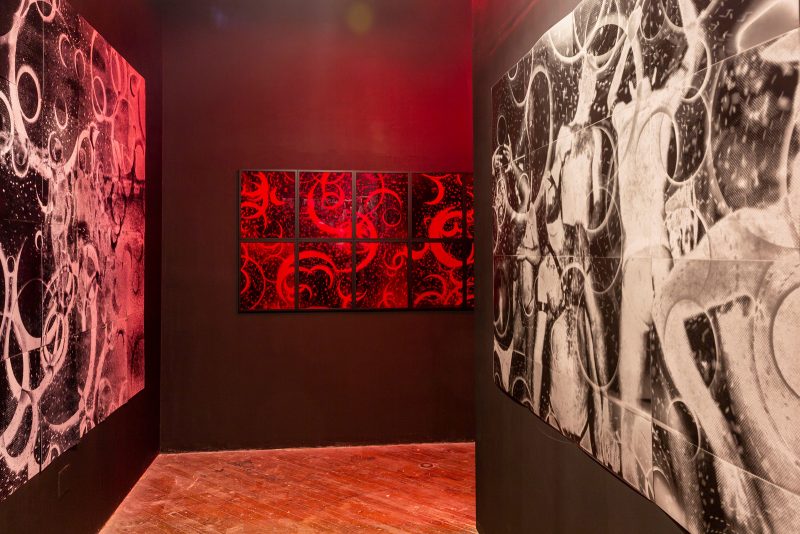 Install view. (Left) “Queer Eclipse (day for night)”, inkjet prints on metallic paper, 80” x 80”, 2019. (Middle) “Bound to the Past (red night)”, silver gelatin prints and Plexiglass, 40” x 128”, 2017. (Right) “Queer Eclipse (trance)”, silver gelatin prints, 56” x 80”, 2019. Photograph is courtesy of the artist, Gabriel Martinez.