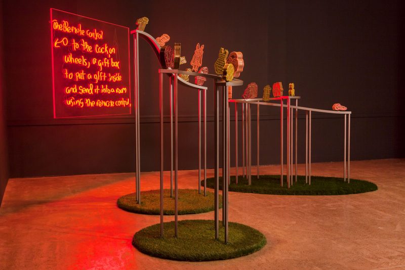 Jacolby Satterwhite, in collaboration with The Fabric Workshop and Museum, Philadelphia. The Remote Control for Cocks on Wheels, 2019. Powder-coated steel, plywood, artificial turf, magnets, PLA filament, epoxy, epoxy resin, enamel, baking soda, superglue, bond filler, plexiglass, LED, and silicone. Sculptures: 62 x 44 (diameter) inches, 78 x 44 (diameter) inches, 54 x 70 (diameter) inches, Neon: 48 x 59 inches. Photo credit: Carlos Avendaño.