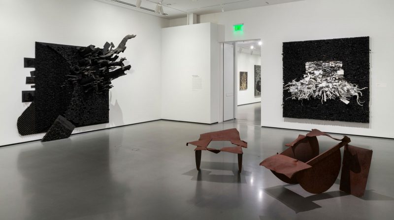 Installation view, "Generations: A History of Black Abstract Art" at The Baltimore Museum of Art. Pictured: Leonardo Drew, "Number 185," 2016, Wood, paint, and chalk 121 × 134 × 30 in., The Joyner / Giuffrida Collection. Leonardo Drew, "Number 52S," 2015, Wood and paint, 96 × 96 × 14 in., The Joyner / Giuffrida Collection. Melvin Edwards, "A Conversation with Norman Lewis," 1979 Welded steel, Element 1 (left): 41 1/2 × 42 3/8 × 27 in. Element 2 (right): 56 × 46 × 31 3/8 in., Courtesy the artist and Alexander Gray Associates, New York. Photo courtesy: Mitro Hood.