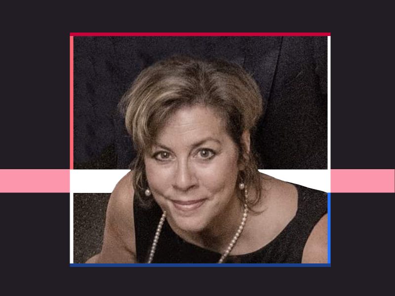Photo of Suzanne DuPlantis on a black background with a colorful border.