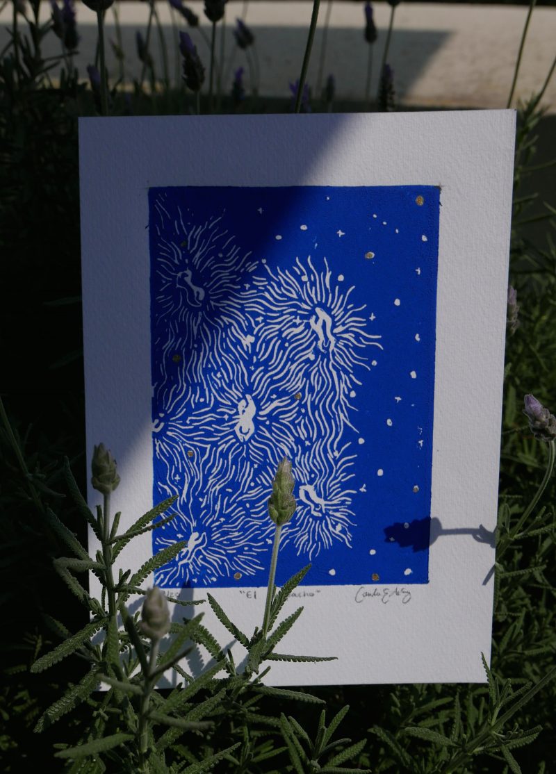 Print of white markmaking on a royal blue background.
