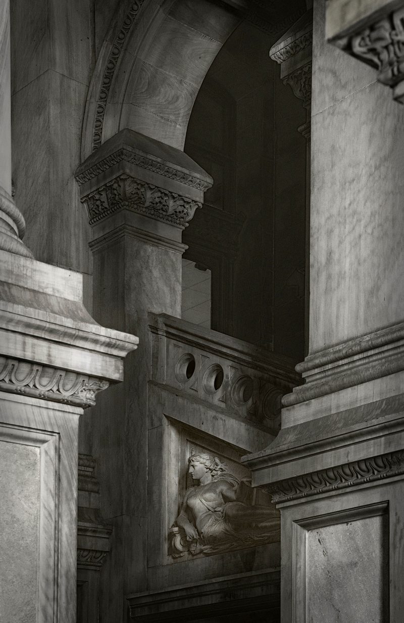 Black and white photograph of pillars in City Hall.