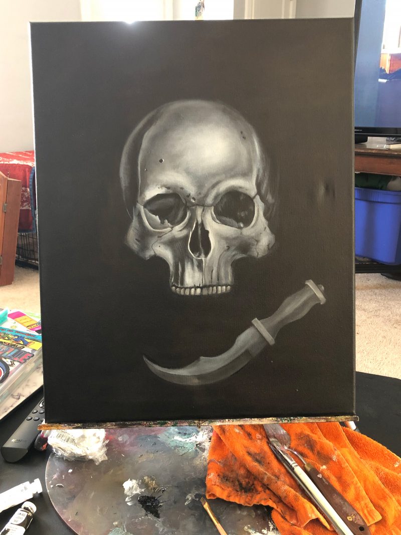 Painting of a gray skull and scathe on a black background.