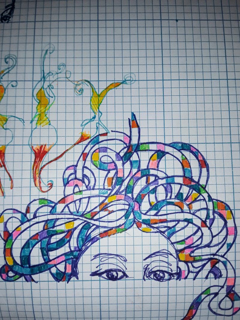 Marker drawing of a female face with long colorful hair entwining into a design above her head.